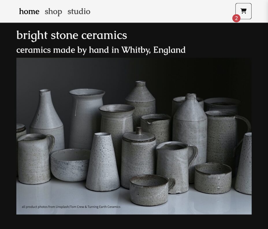 a screenshot of website Bright Stone Ceramics, Homepage, a group of ceramics and shopping cart icon with number of items in cart